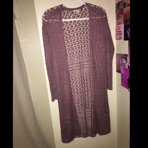 Lightish purple cardigan.